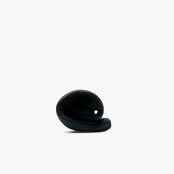 The VIVOBAREFOOT Asana Yin Ballerina Knit (Women's) is displayed curled from toe to heel, showcasing its flexibility against a plain white background.