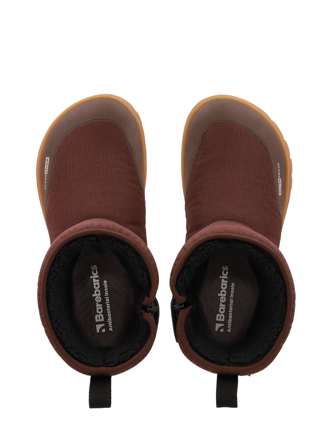 Top view of Barebarics Polarstride (Women's) brown slip-on winter boots with black inner lining, tan rubber soles, pull tabs at the back, insoles branded Barebarics Adventure Inside, and a waterproof membrane for extra protection.